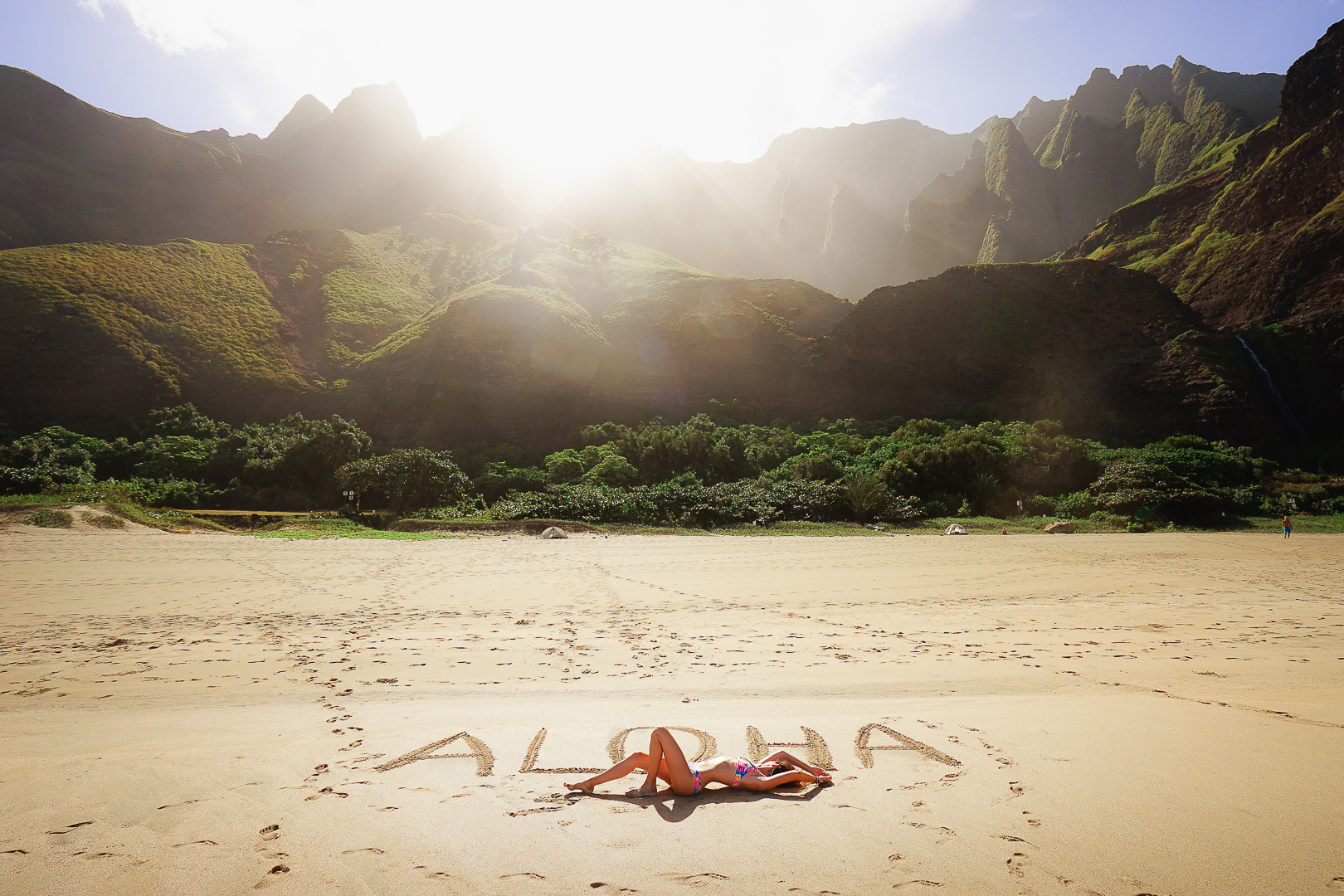 Jess Wandering relaxing on Kalalau Beach in Kauai.