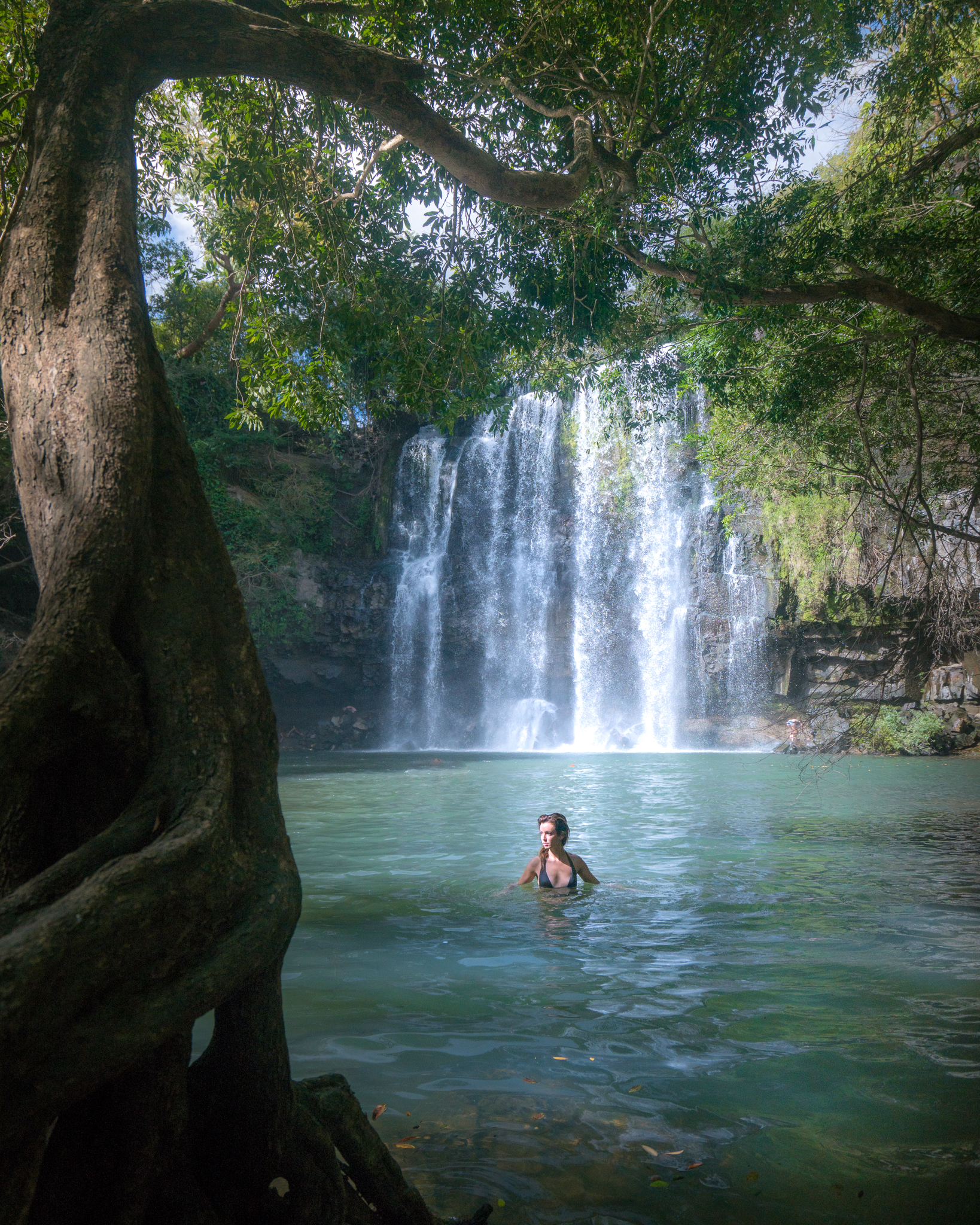 Swimming in Llanos de Cortez Waterfall, Costa Rica.