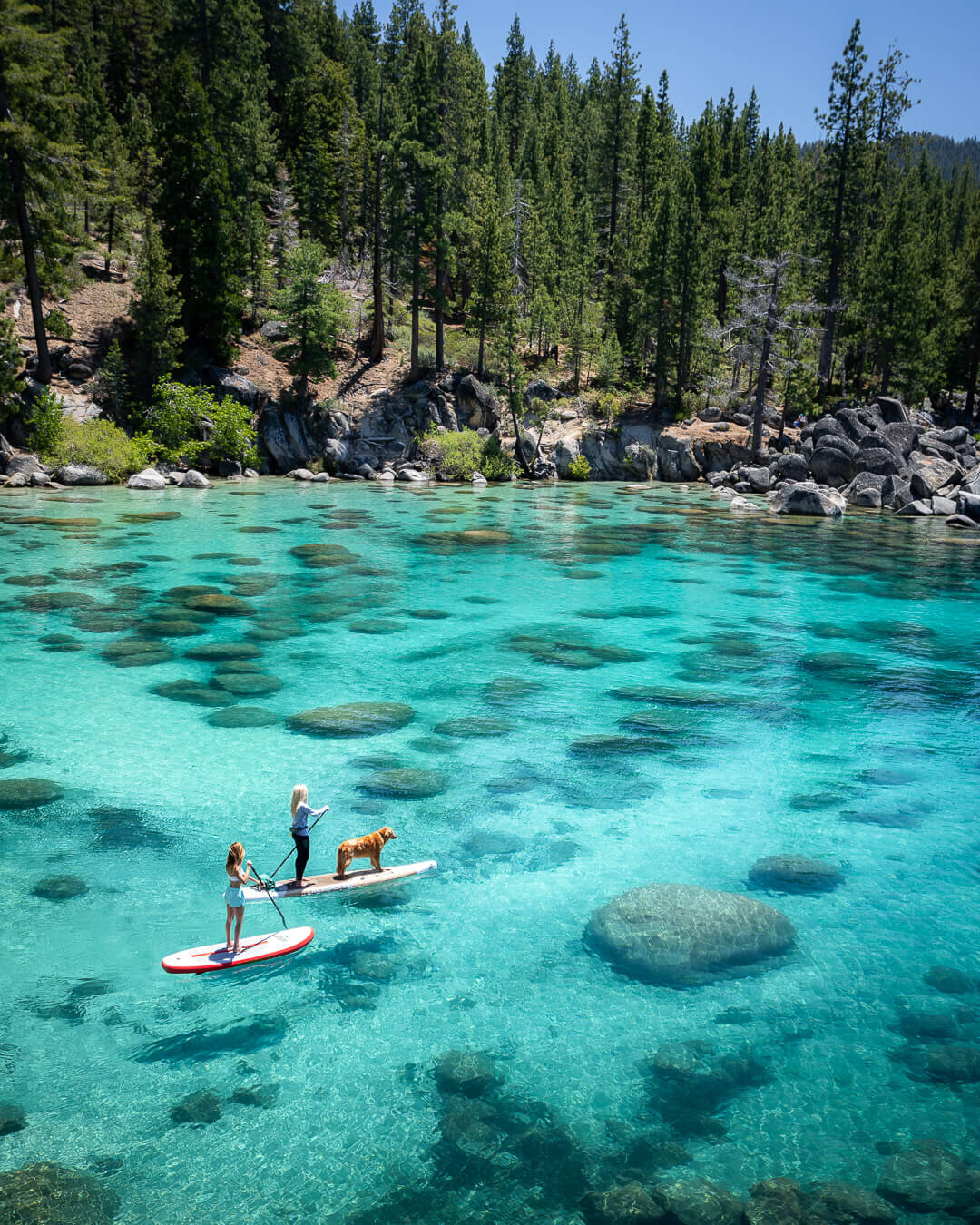 Paddle boarding with friends at Secret Cove, Lake Tahoe.