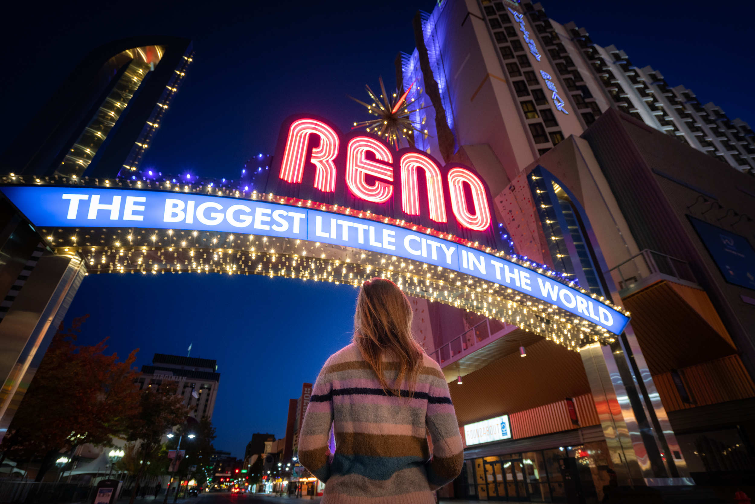 Standing under the famous Reno Arch Sign in downtown Reno.
