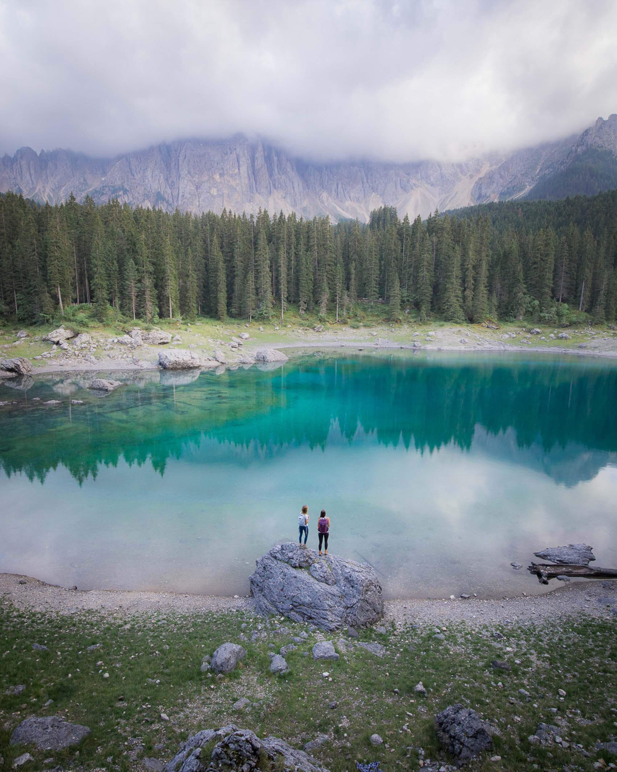 Lago di Carezza hike (also known as Karersee) in the Italian Dolomites. It is my understanding that you are no longer allowed to go down to the lake. There is now a walkway with a railing to guide.