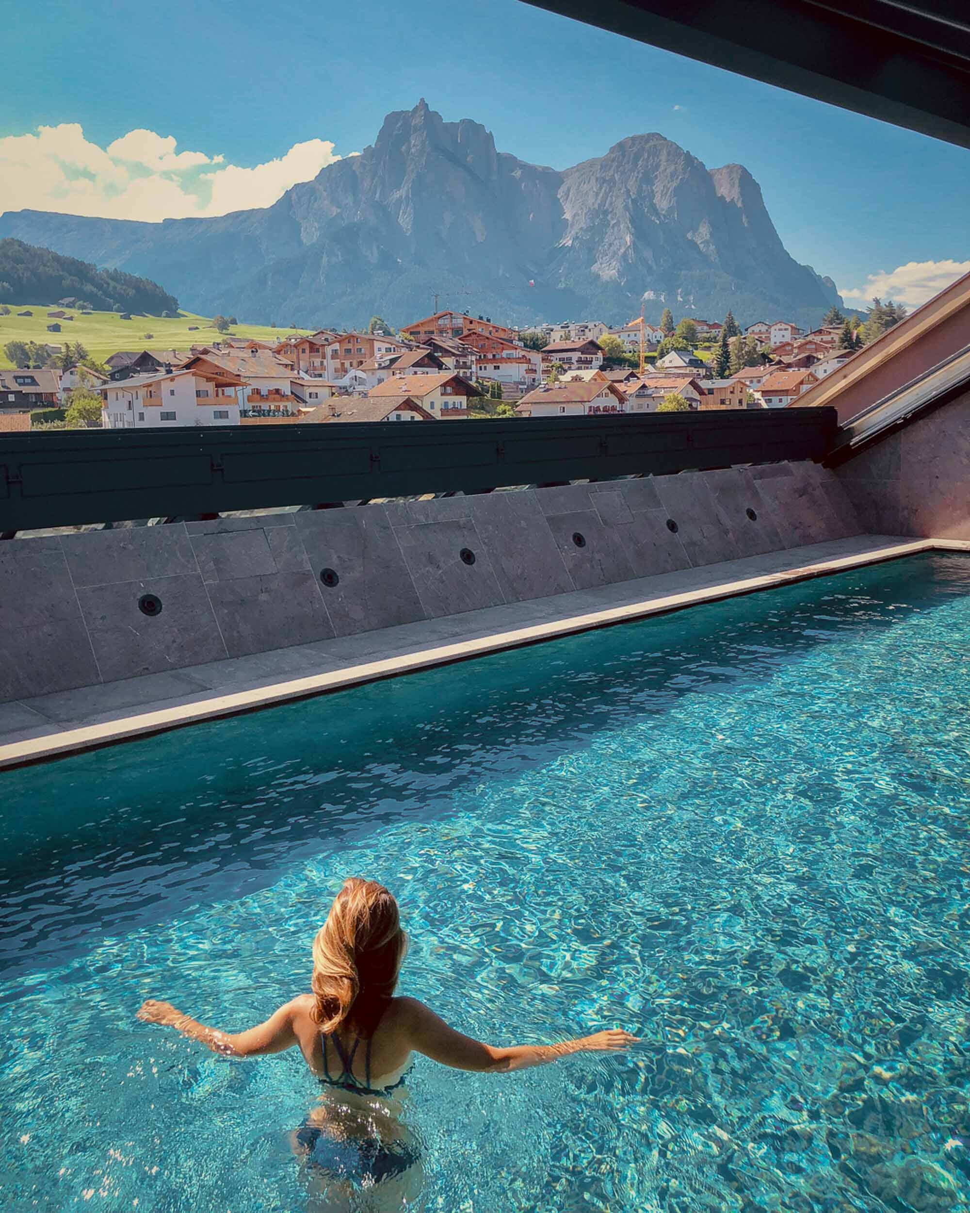 The rooftop pool at Hotel Lamm, overlooking the Dolomites.