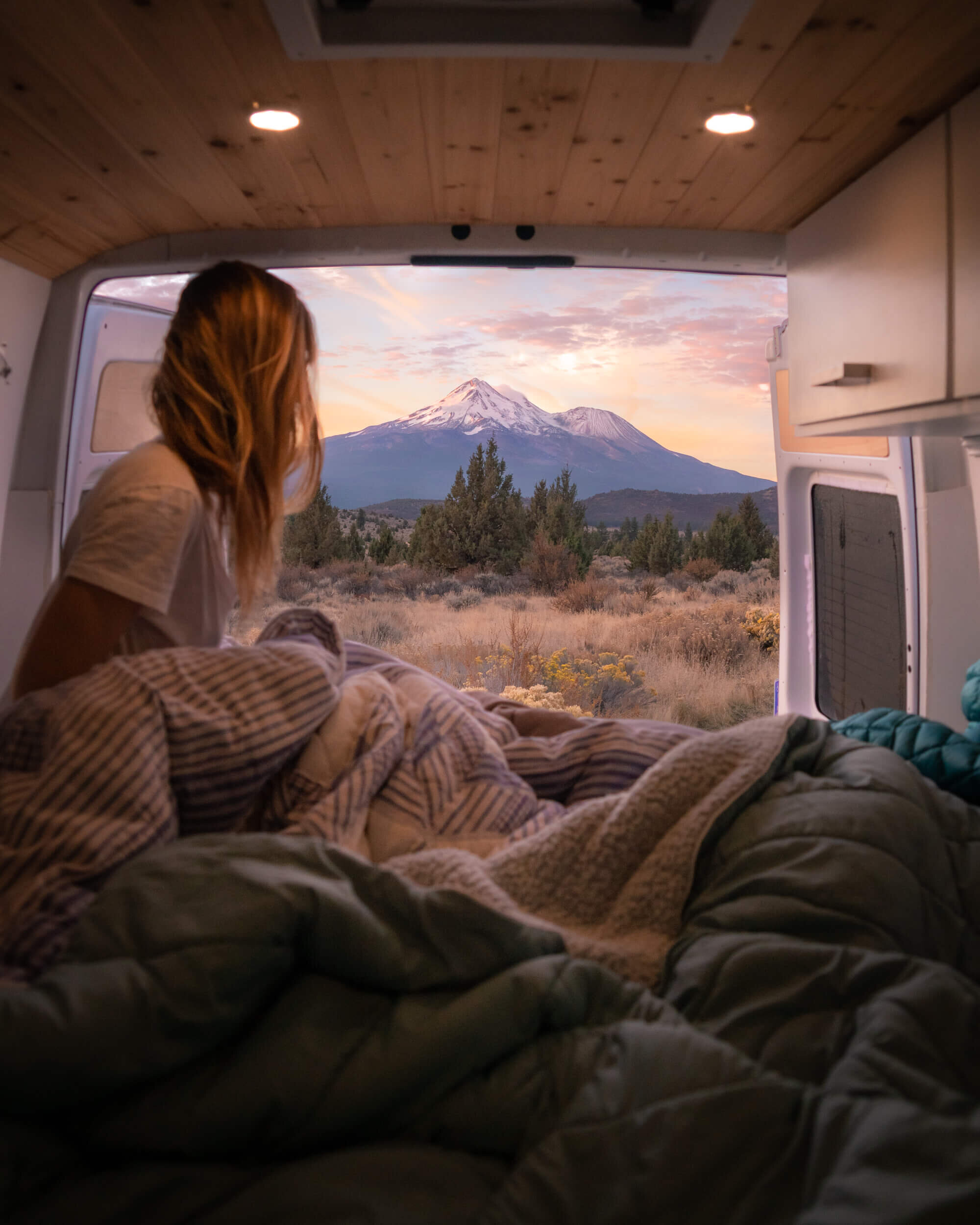 Taking in a spectacular sunrise over Mount Shasta from the back of our camper van.