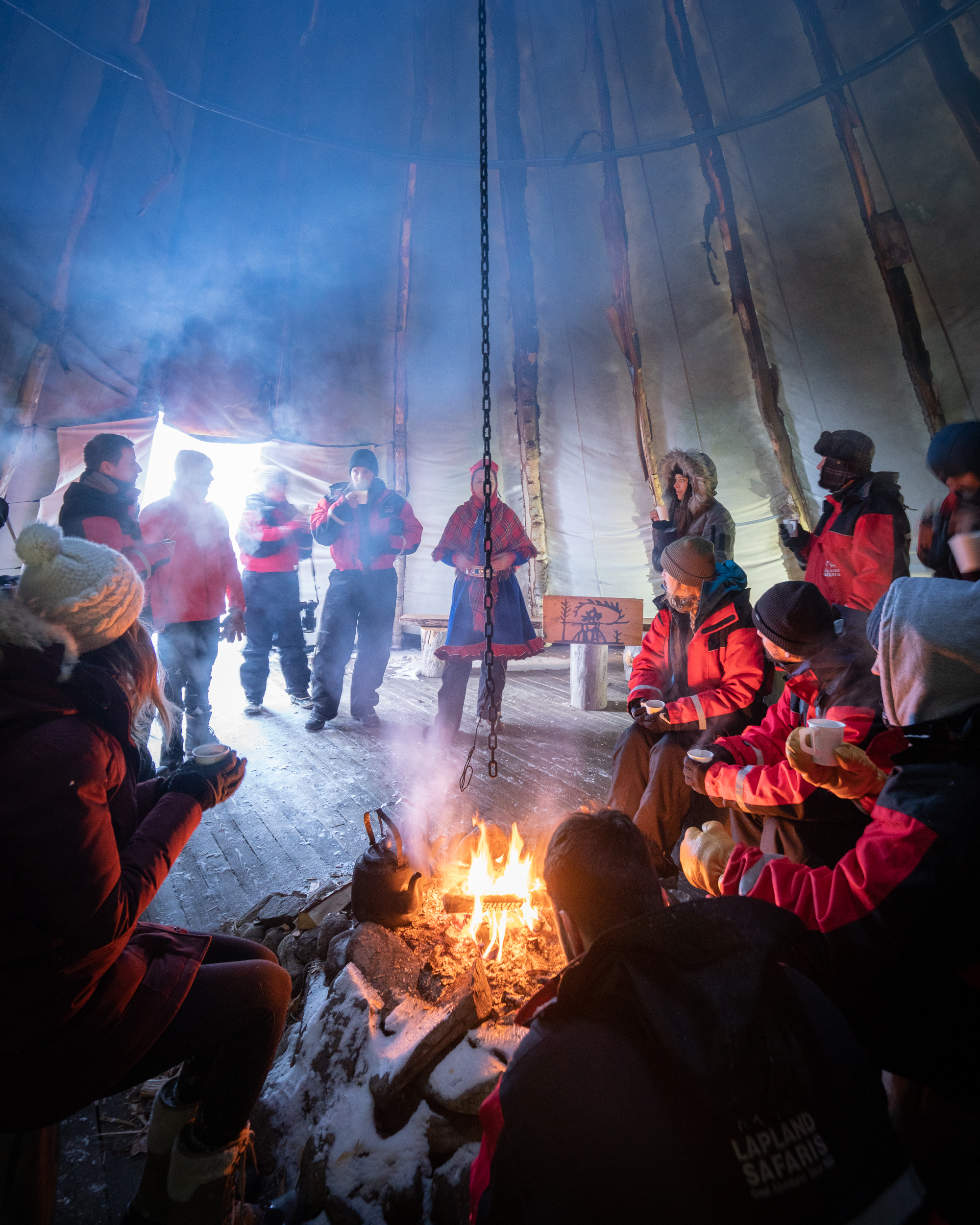 Enjoying tea around the fire with the Sami people.