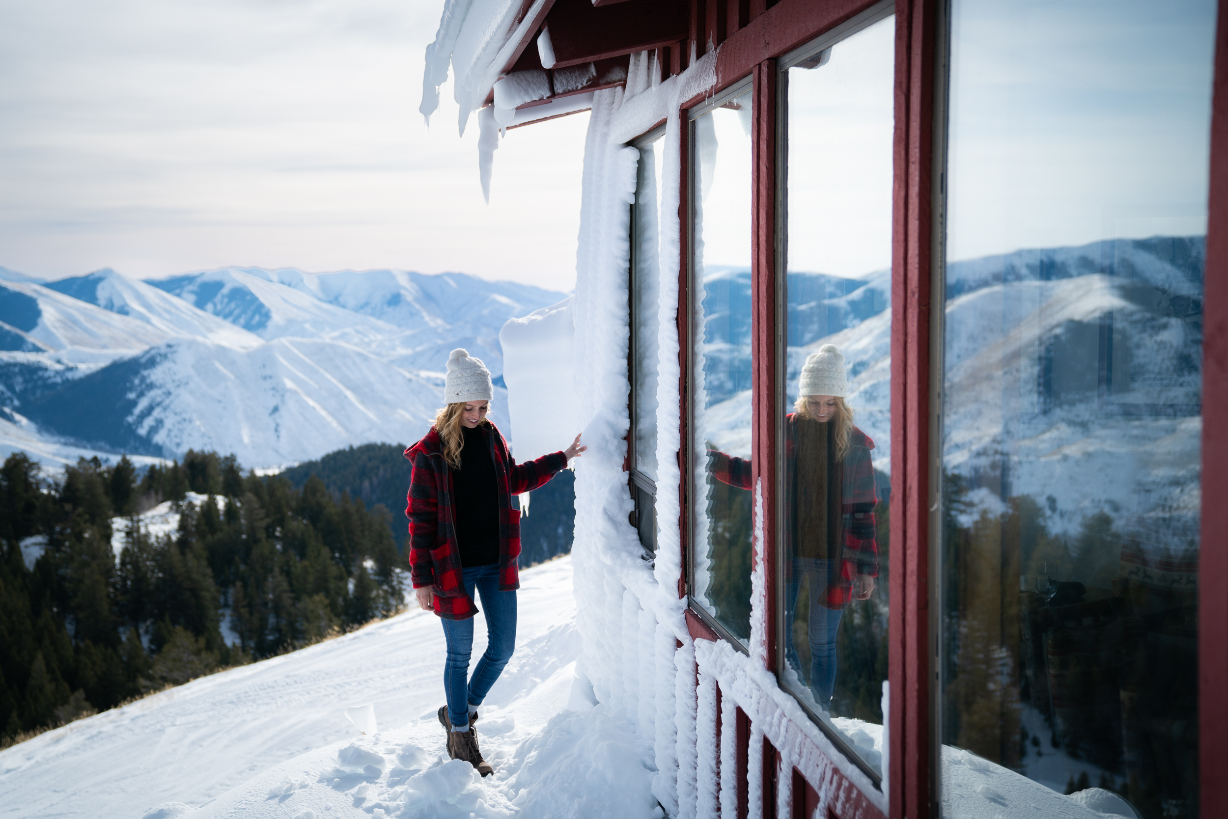 Jess visiting a restaurant on the top of a mountain covered in snow