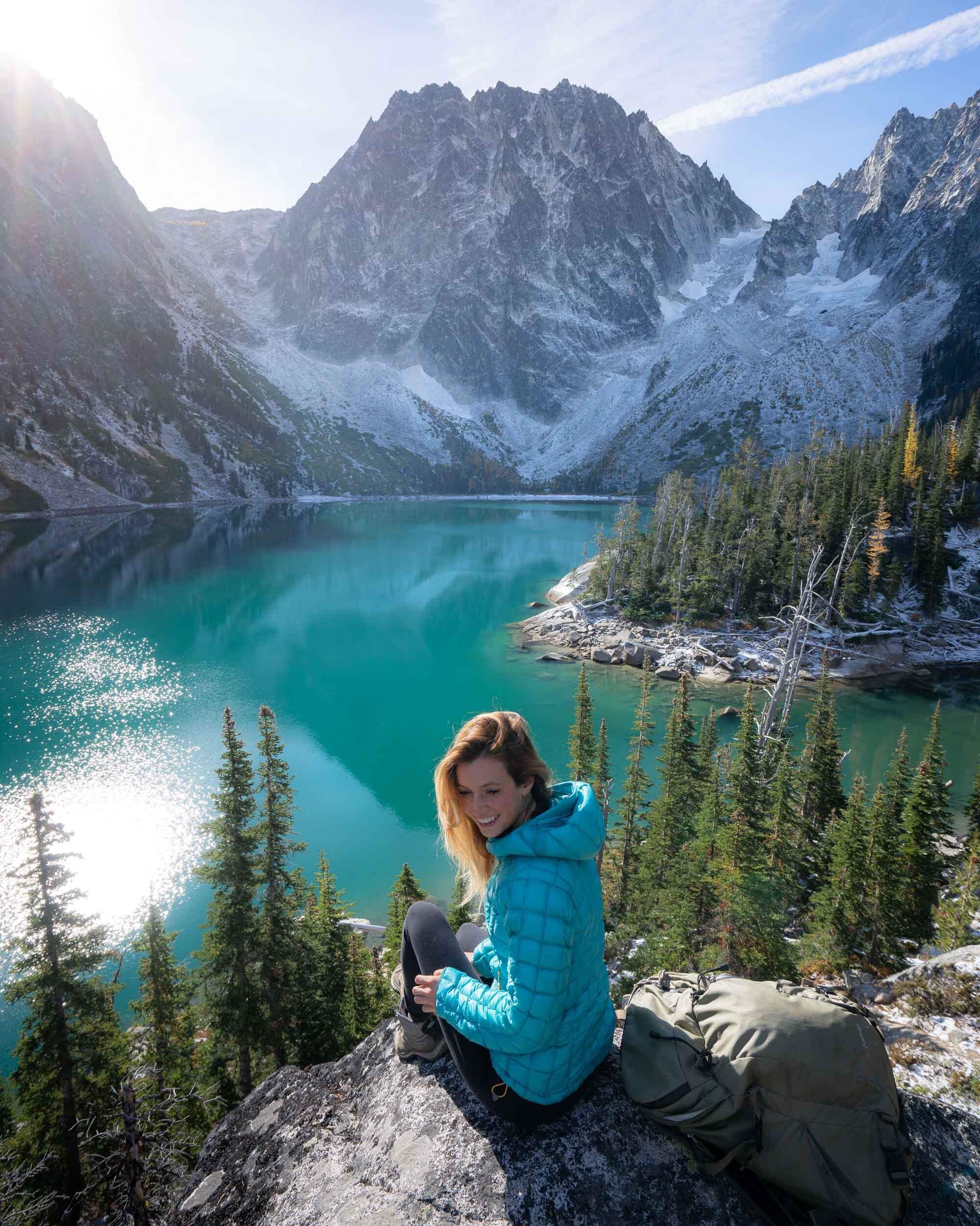 Colchuck Lake is one of the prettiest lakes in Washington’s Alpine Lakes Wilderness. Wearing: Rab  Down Jacket , Keen  Hiking Boots .