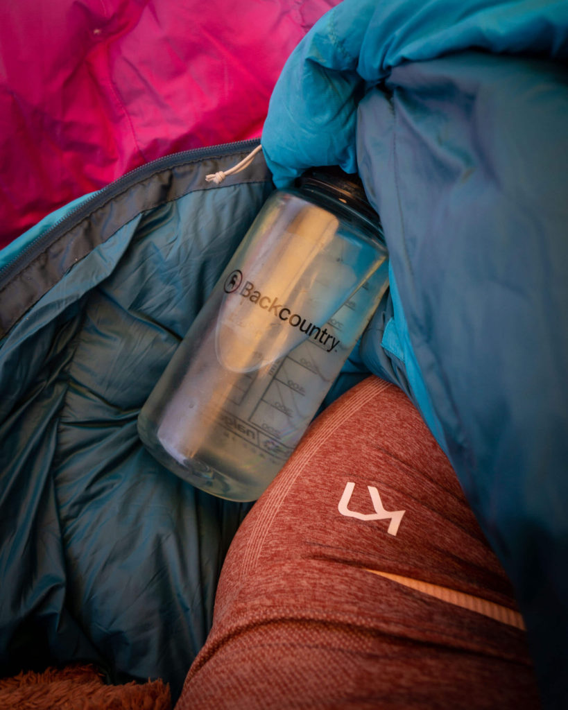 Backcountry Nalgene water bottle on top of sleeping bag