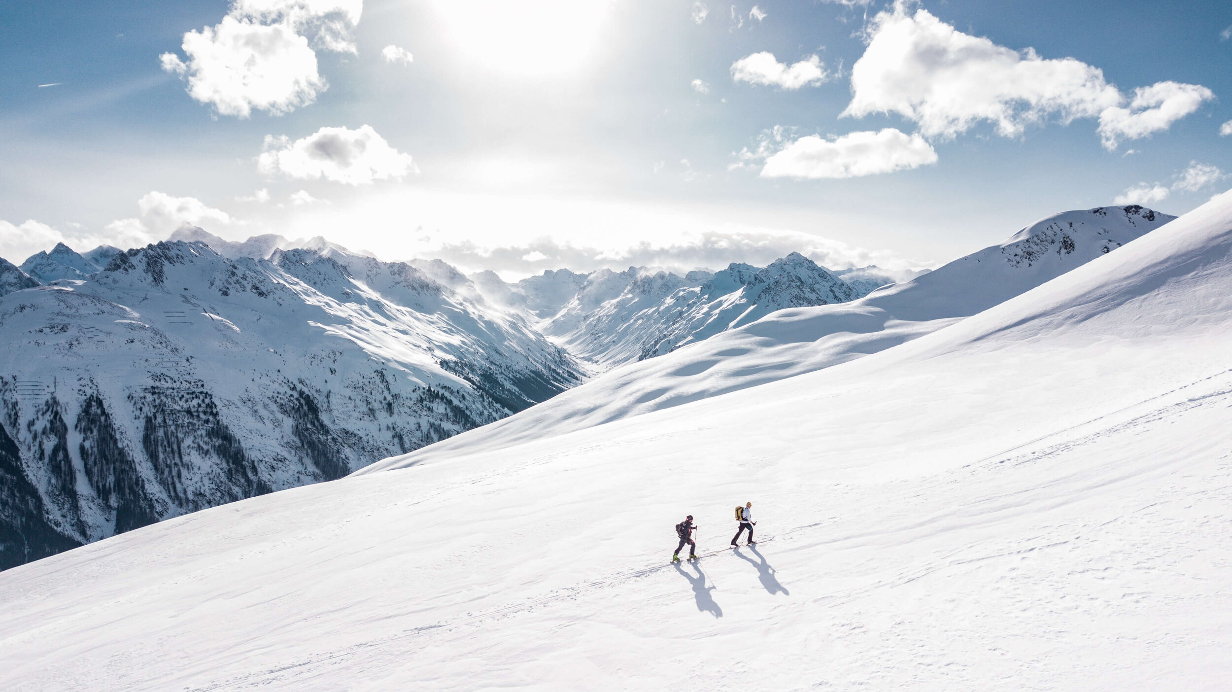two-man-hiking-on-snow-mountain-869258.jpg