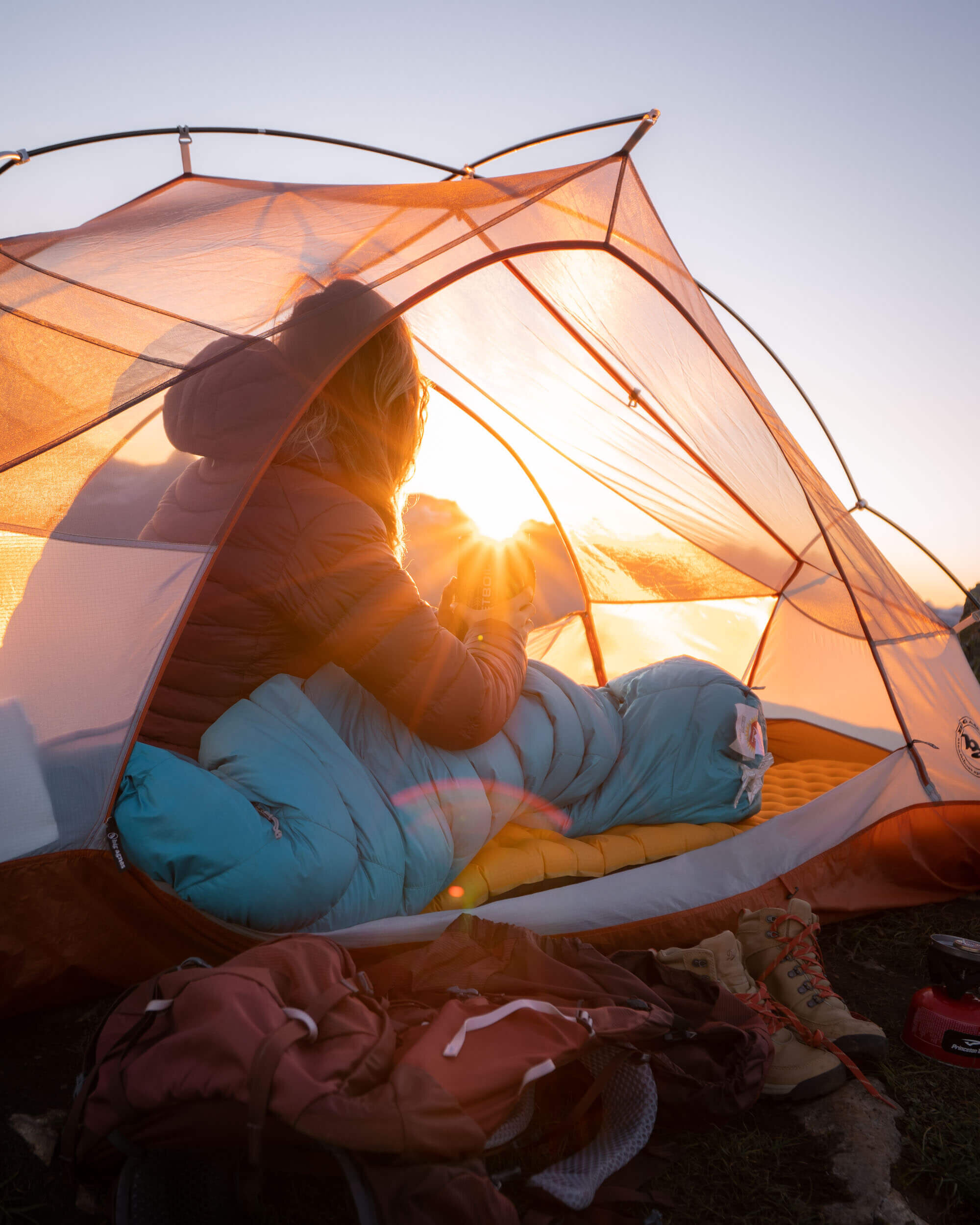 Waking up at sunrise in the North Cascades. Wearing:  Arc'teryx Cerium LT Hooded Down Jacket . Also shown:  Marmot Women's Xenon 15° Sleeping Bag ,  NEMO Sleeping Pad ,  Big Agnes Copper Spur HV UL 2P Tent .