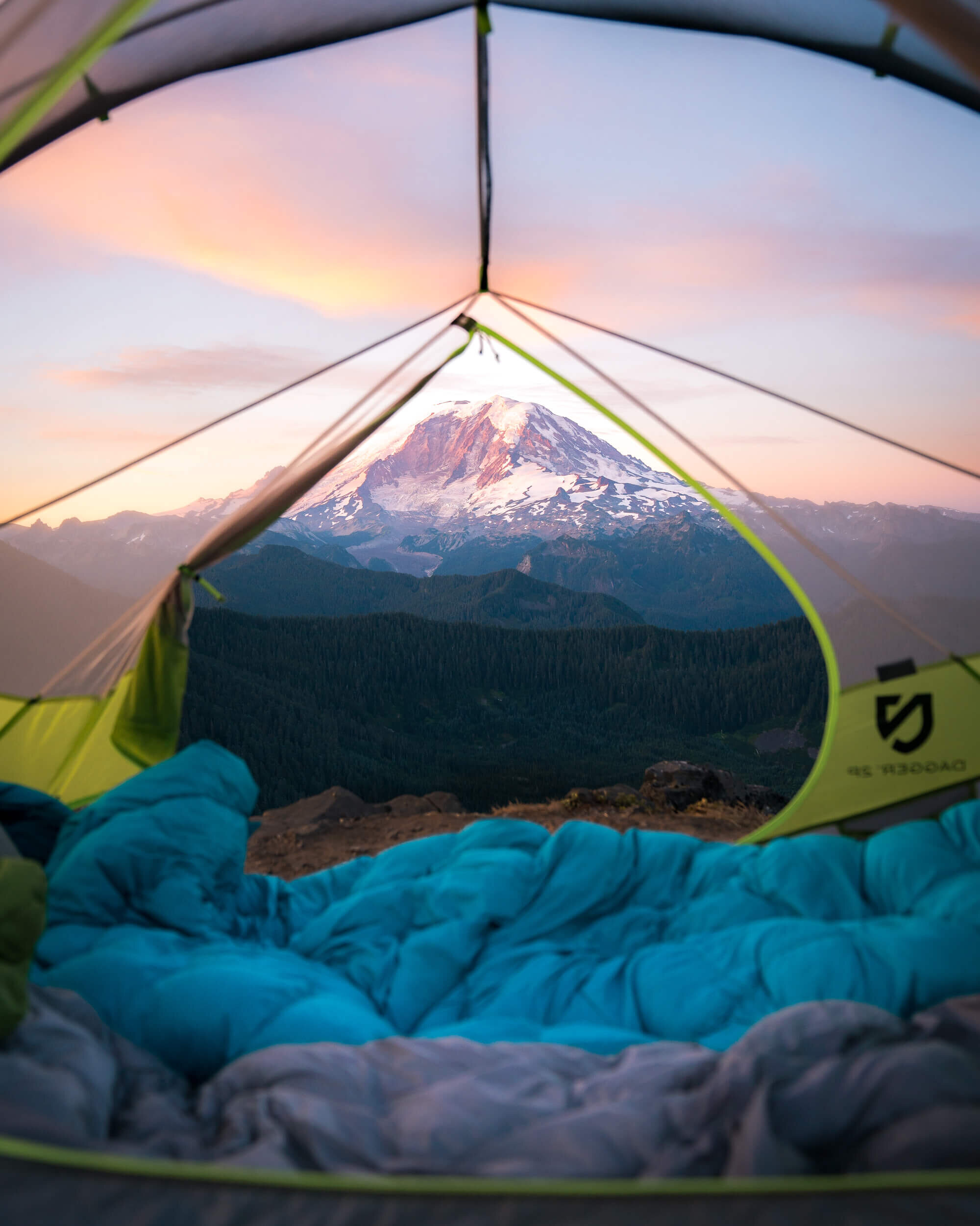 Camp spot at with a view of Mount Rainier in the distance. Shown in photo:  NEMO Equipment Tent , Marmot 15 Degree  Sleeping Bag .