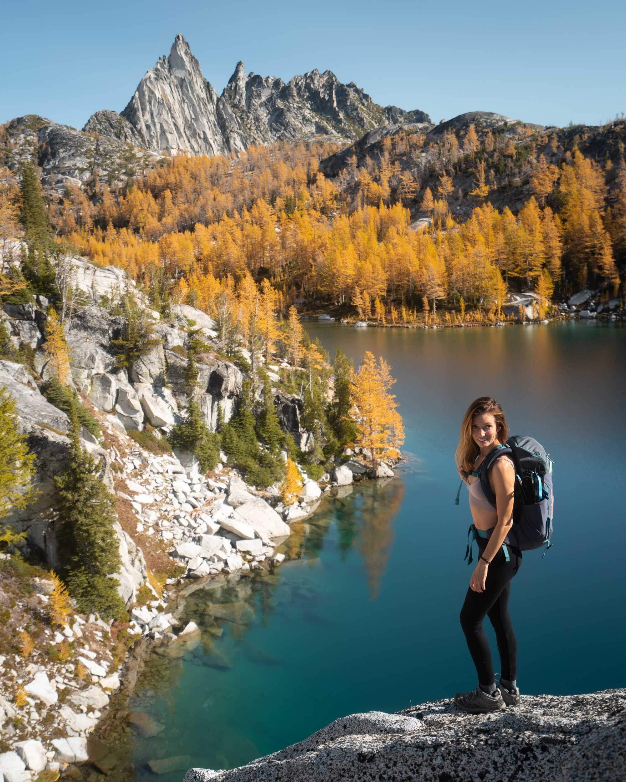 There are endless blue alpine lakes to stop and admire in The Enchantments. Wearing  Icebreaker  base layers, Keen Terridora Hiking Boots, and Patagonia’s 9 Trails Backpack.
