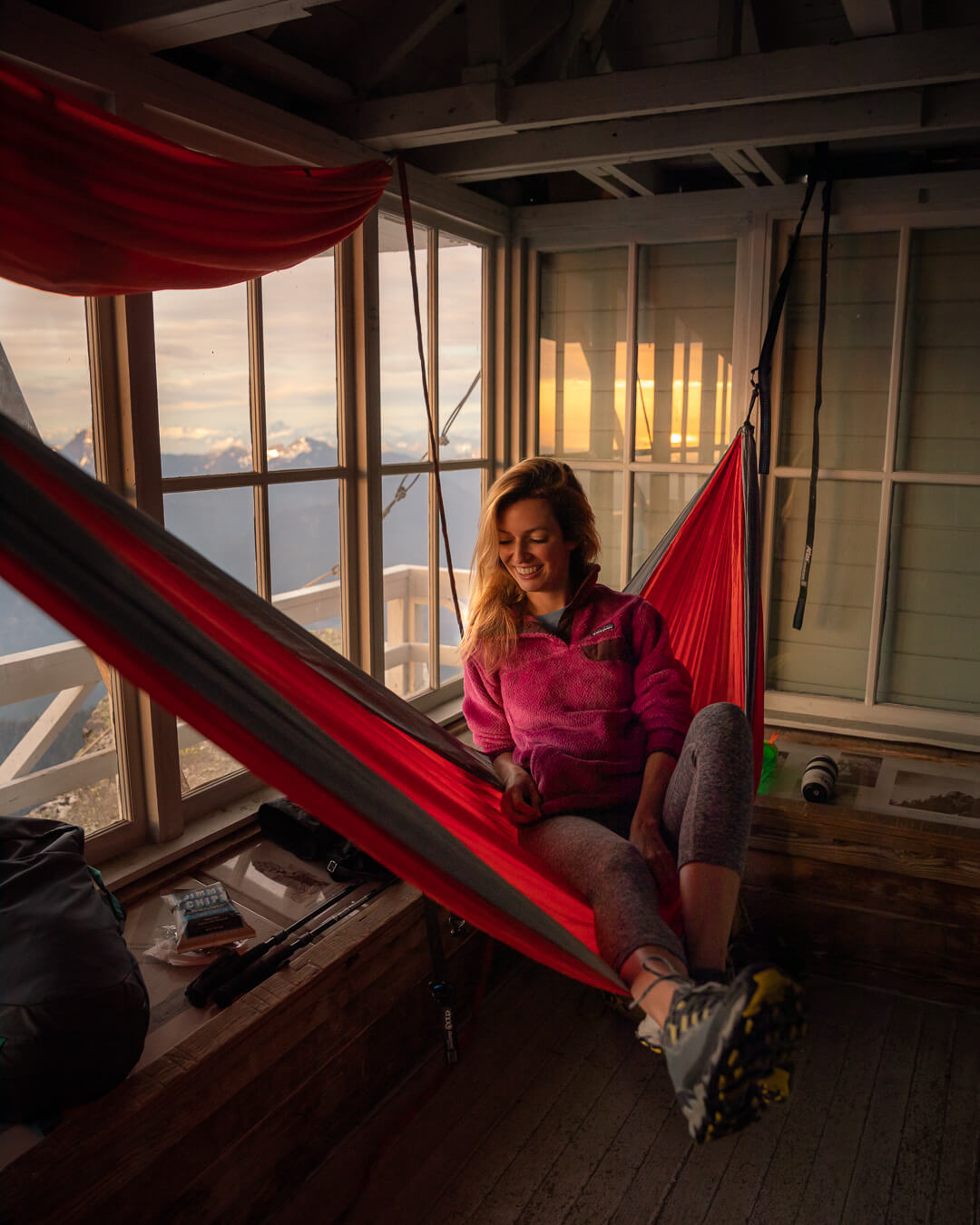 Hanging out in the Mount Pilchuck fire lookout. Wearing:  trail running shoes ,  leggings ,  jacket ,  hammock  // Photo by  Kyle Kotajarvi