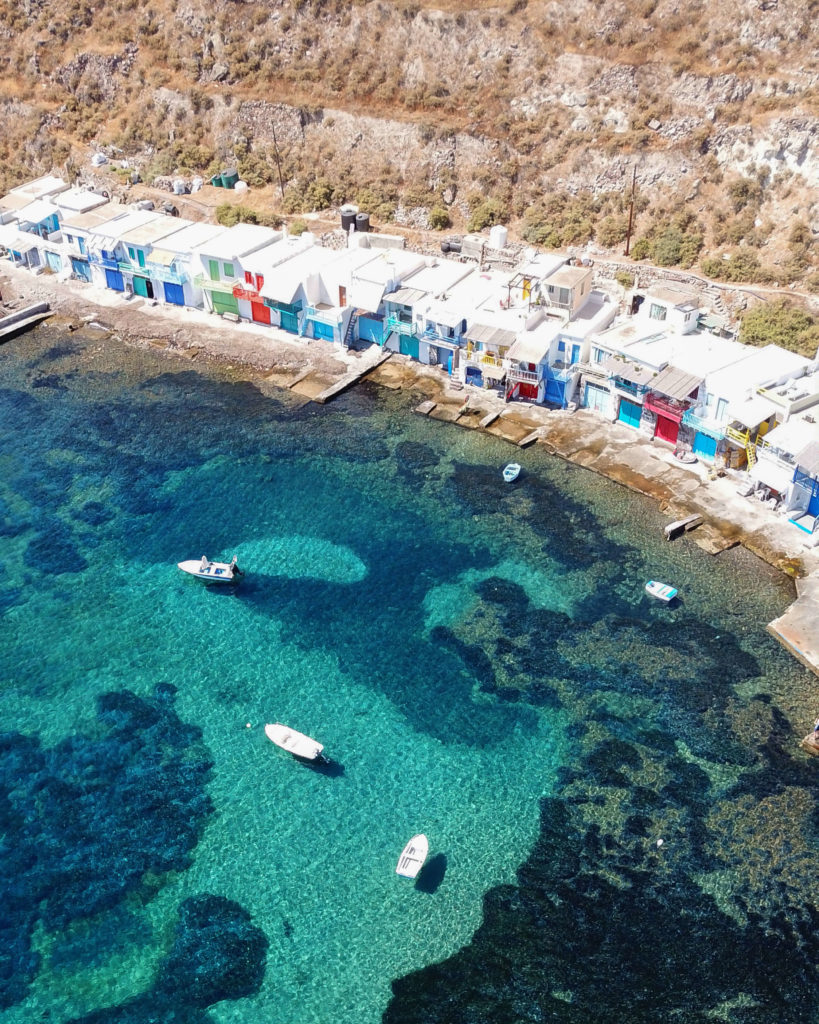 Colorful buildings line the coast in the small fishing village of Klima on Milos Island. 
