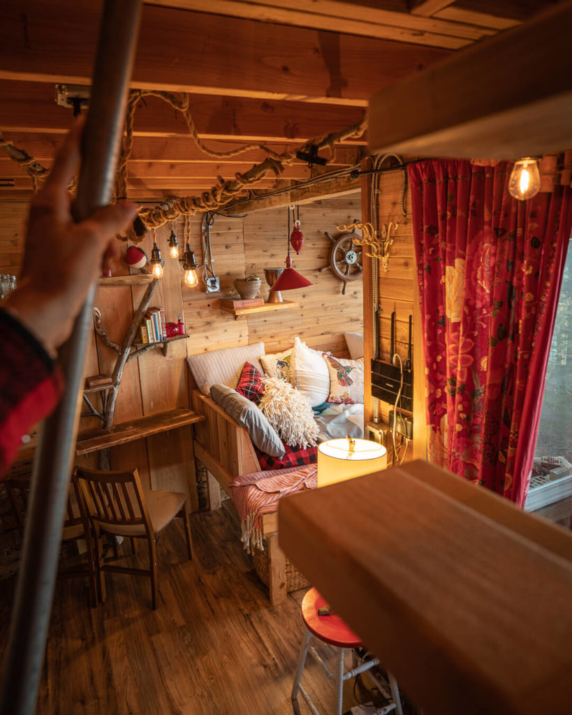 interior of Eagle's Perch tree house in Washington, one of the best cozy pacific northwest cabins to rent