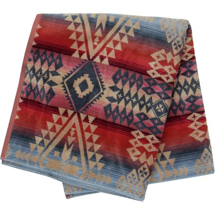 a Pendleton blanket in red, blue and beige pattern 