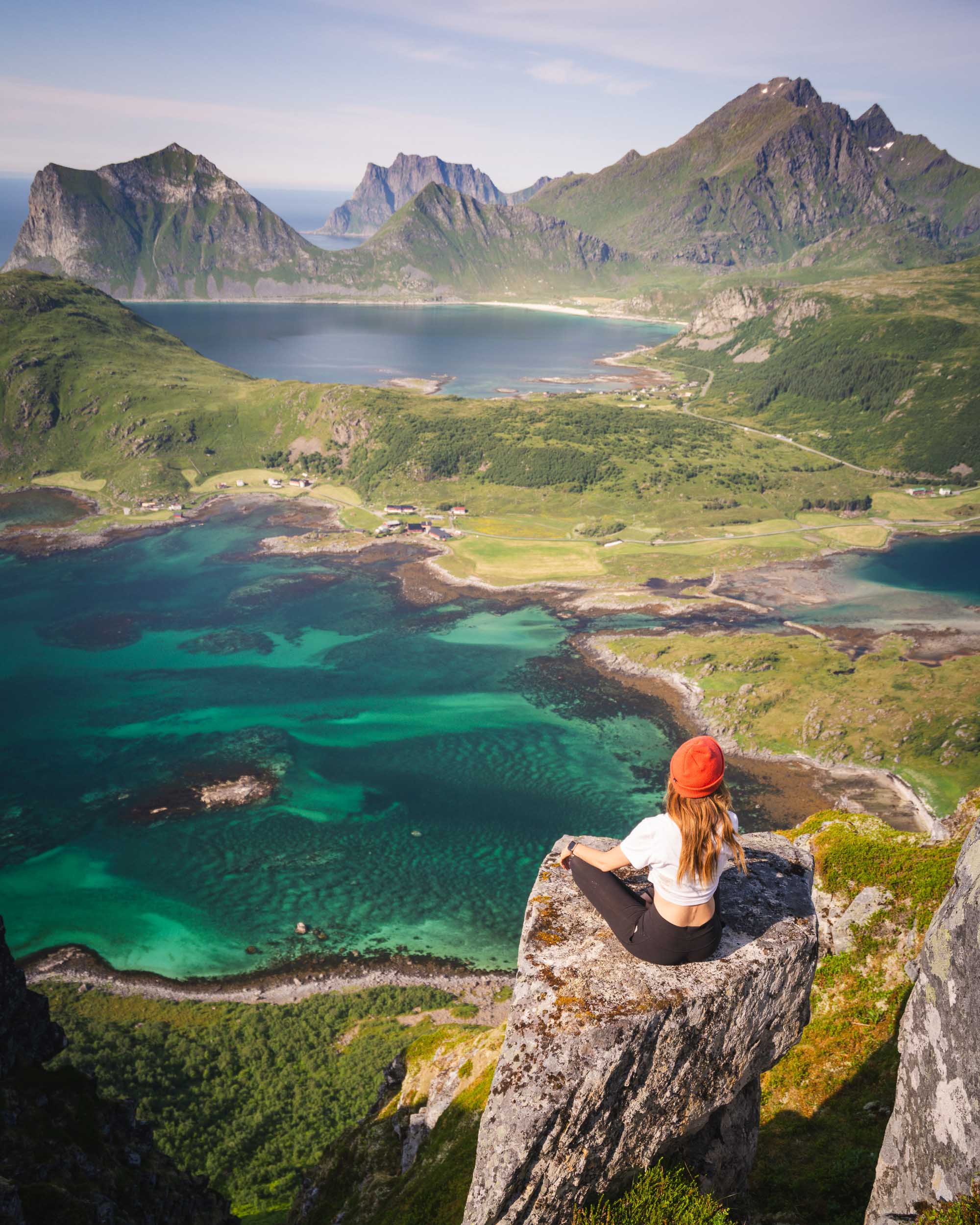 Jess Wandering sitting down and enjoying the view from Offersøykammen hike in the Lofoten Islands
